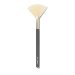 White fan makeup brush with silver ferrule and white bristles for lightweight highlighting